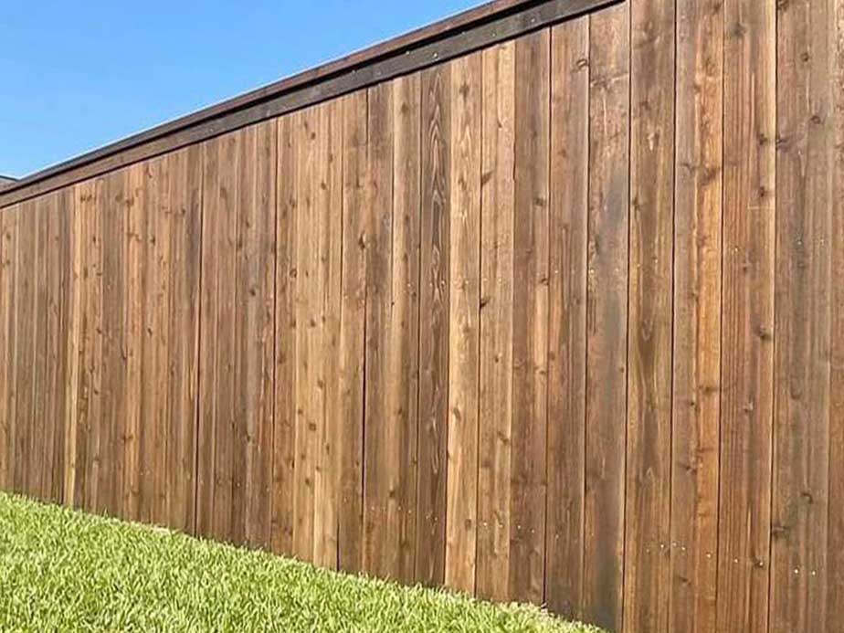Broussard LA cap and trim style wood fence